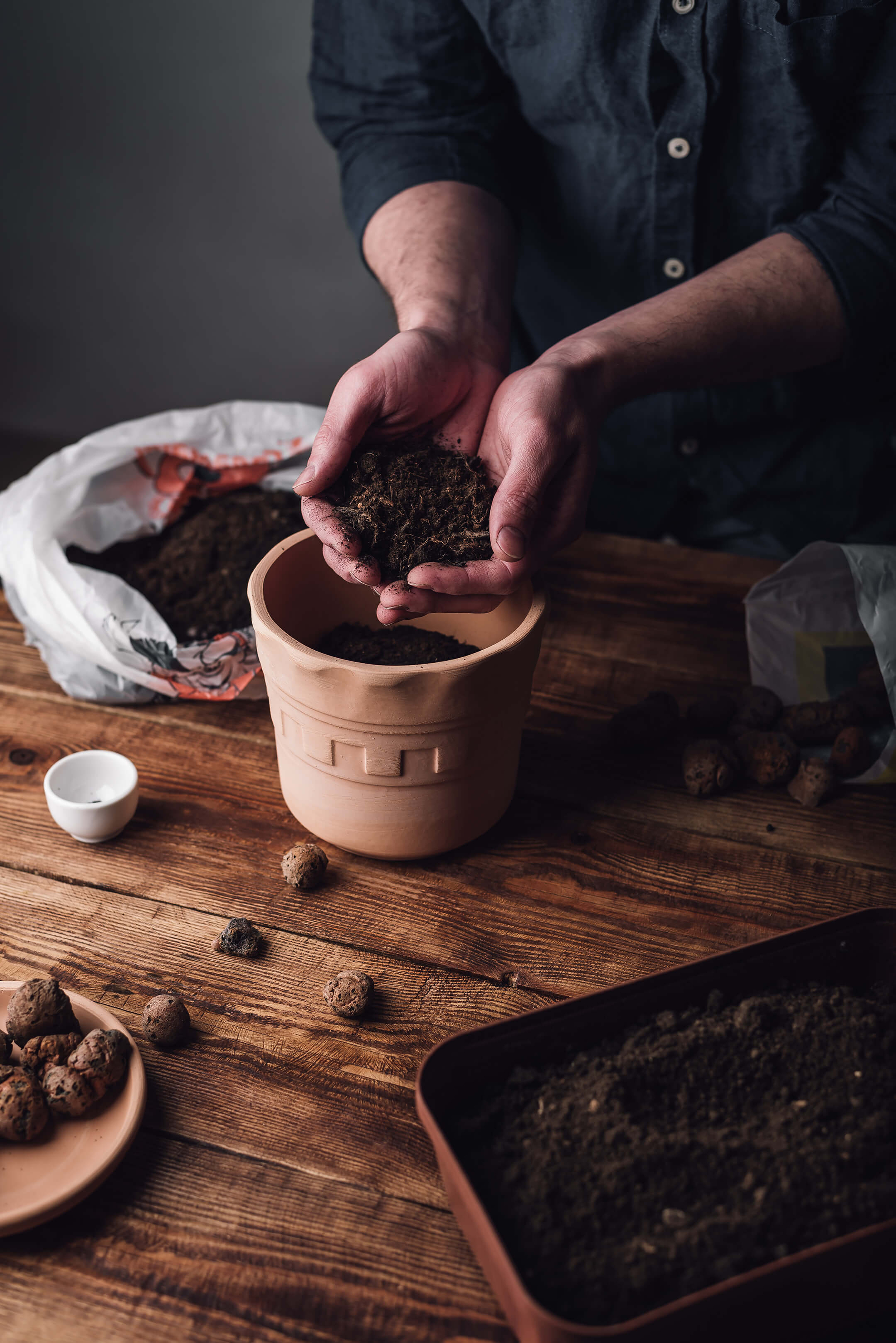 man-putting-potting-soil-into-pot-1080px man-putting-potting-soil-into-pot-1080px